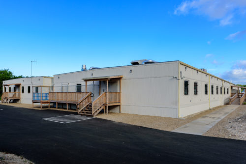 Exterior view of two semi-permanent modular buildings totaling over 25,900 square feet to house the relocated Army medical office and labs