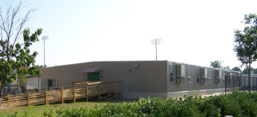A large 126’ x 64’ semi-permanent modular building totaling 8,064 square feet used for adding extra classrooms