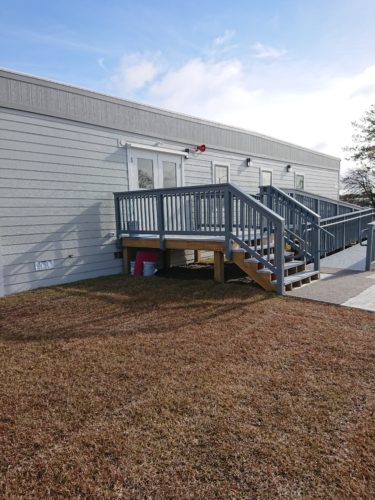 Exterior View of a portable office building with stairs and ramp